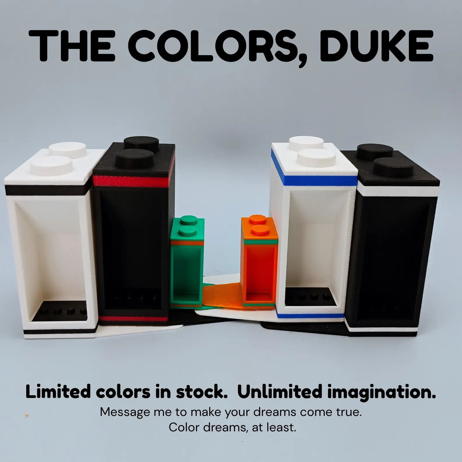 Color options for LEGO® minifigure bookends shown in black, red, green, and blue. Each includes display mounts for showcasing minifigs.