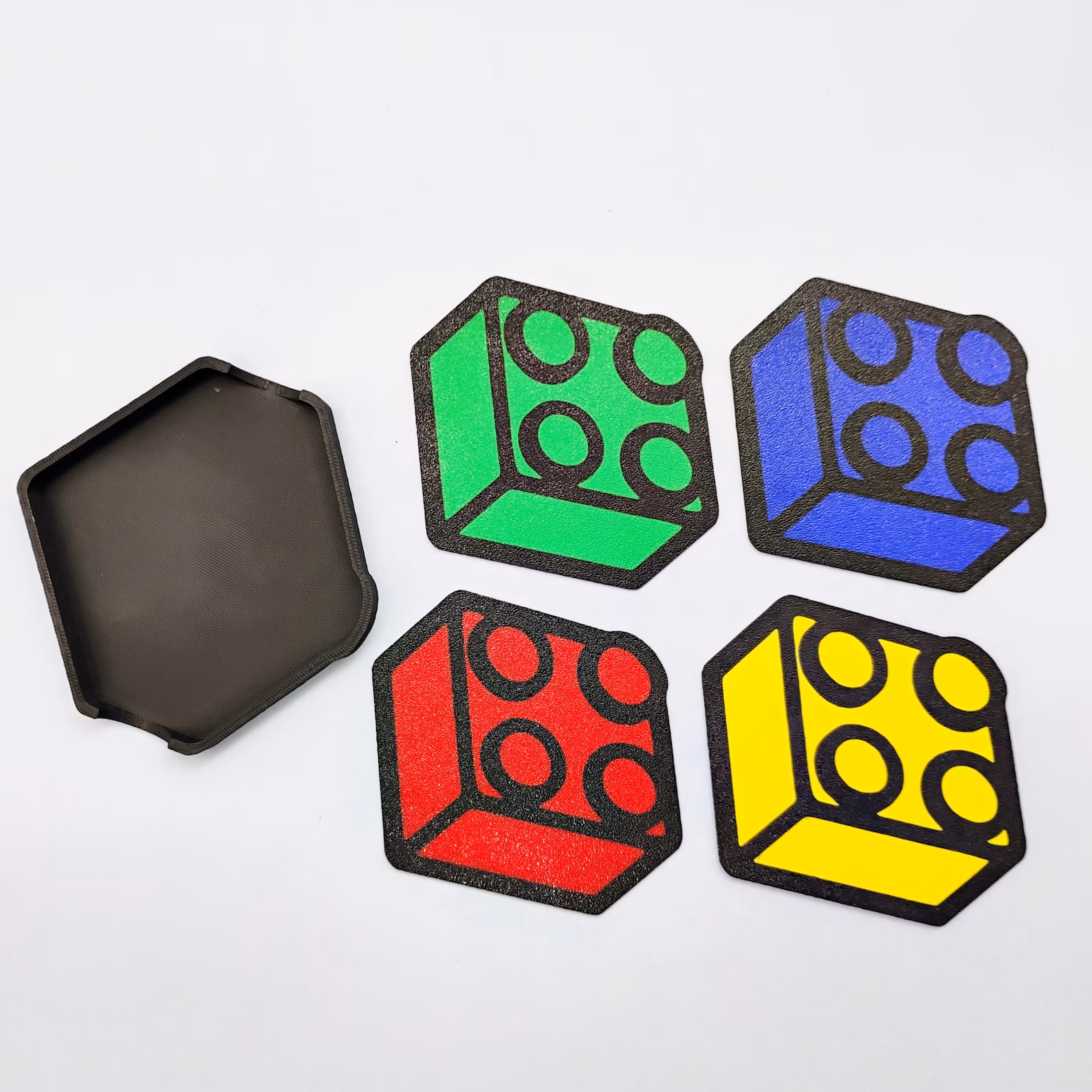 Multicolor brick-themed coaster set featuring red, yellow, green, and blue.