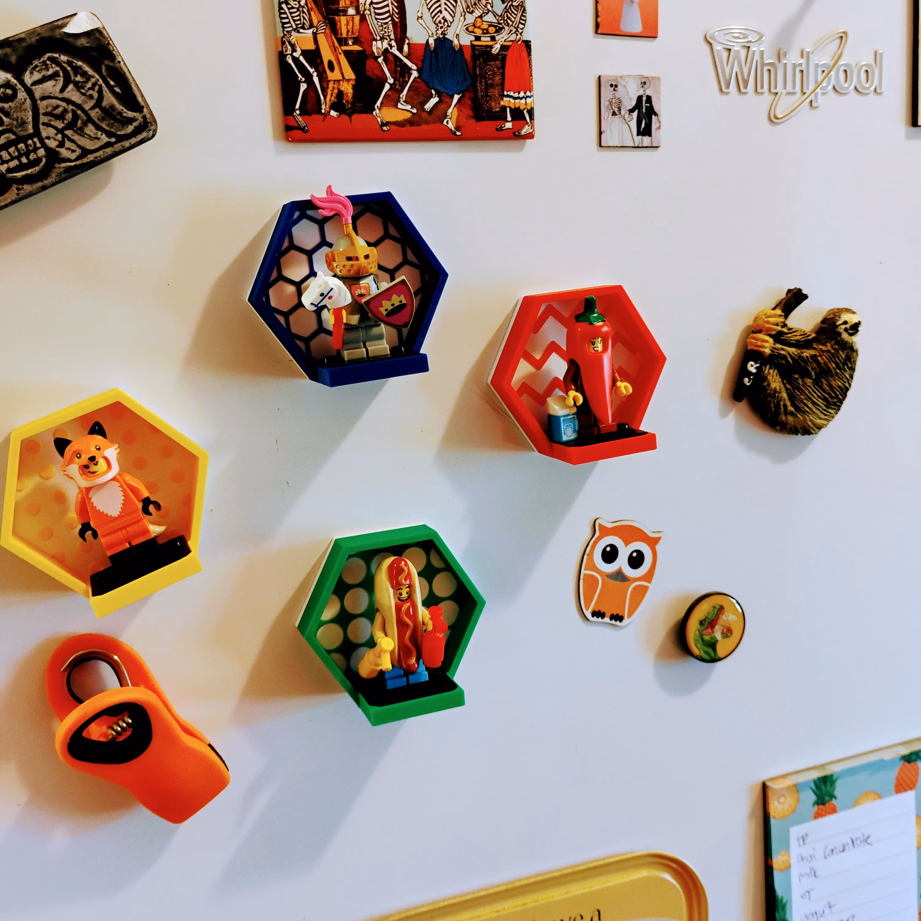 Close-up of LEGO® magnetic minifigure display on fridge showing strong magnetic hold. Perfect for fridge decor and toy photography backgrounds.