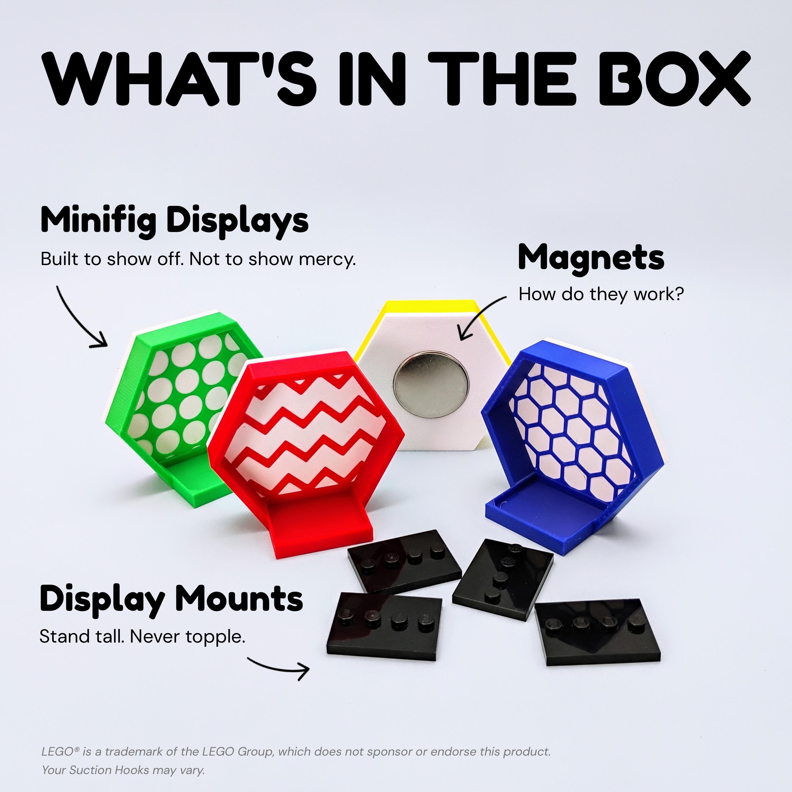 Flat lay photo showing what's in the box for magnetic LEGO® minifigure displays: hex mounts, magnets, and plates for secure setup on fridges or metal boards.
