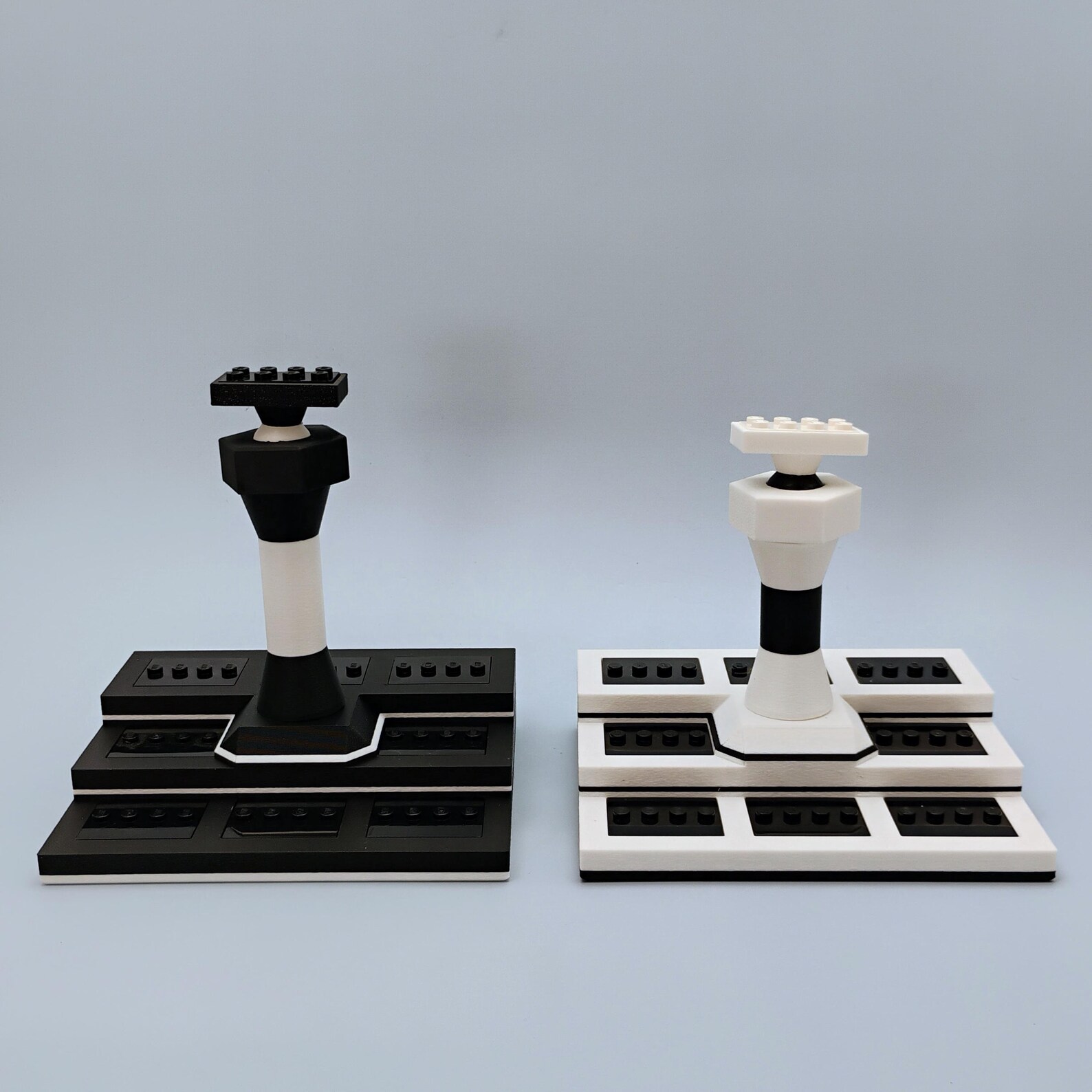 Minifig display base shown with parts laid out to illustrate the included pieces and configuration options.