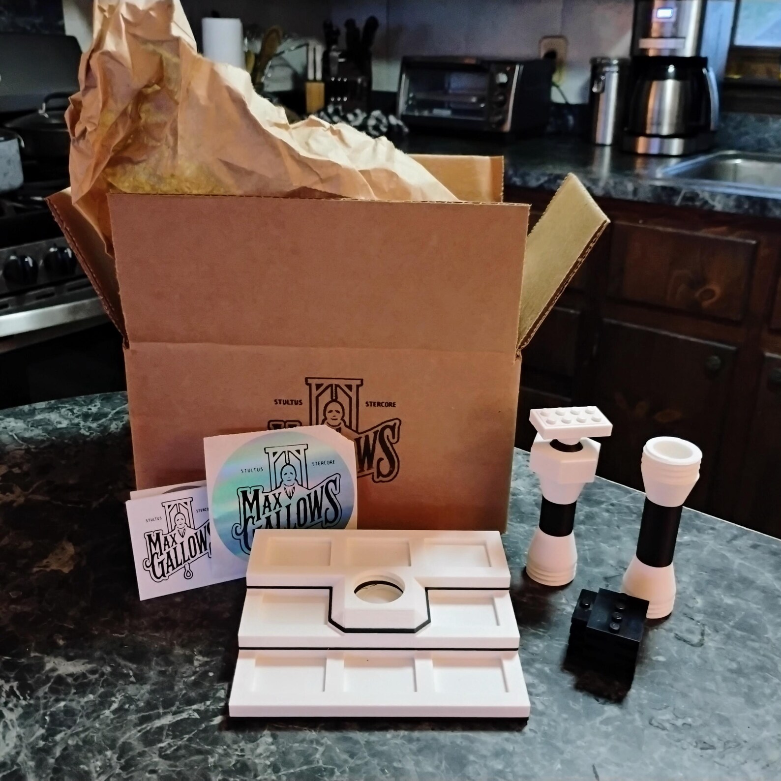 Packaging photo of the minifig display with ship stand showing the product packed for shipping.